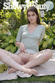 This lovely girl invites you to watch her strip naked outdoors and show off her ass and pussy